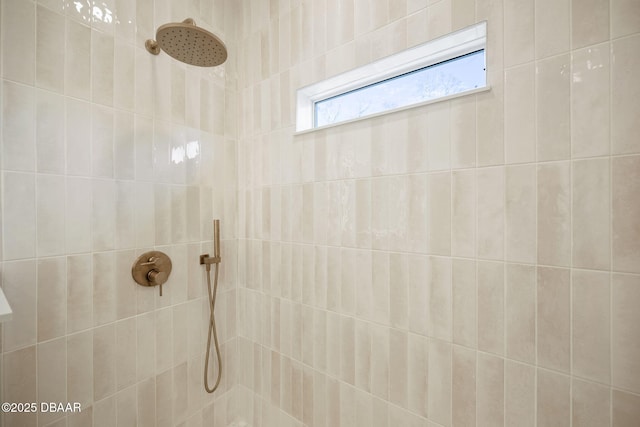 bathroom with tiled shower