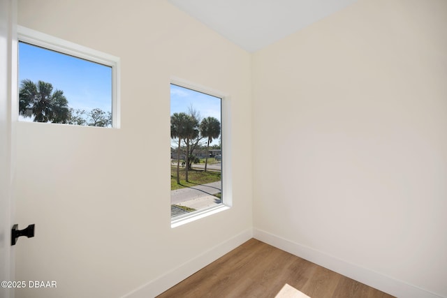 unfurnished room featuring wood-type flooring