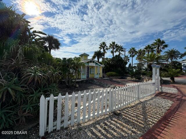 3000 Ocean Shore Blvd Unit 15, Ormond Beach, FL 32176 - view of front facade with a fenced front yard