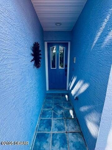 3000 Ocean Shore Blvd Unit 15, Ormond Beach, FL 32176 - property entrance featuring stucco siding