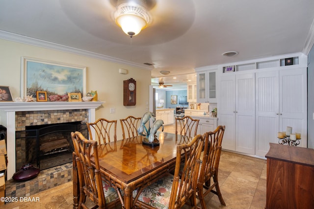 living room featuring ornamental molding and ceiling fan