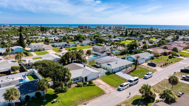 birds eye view of property with a residential view and a water view