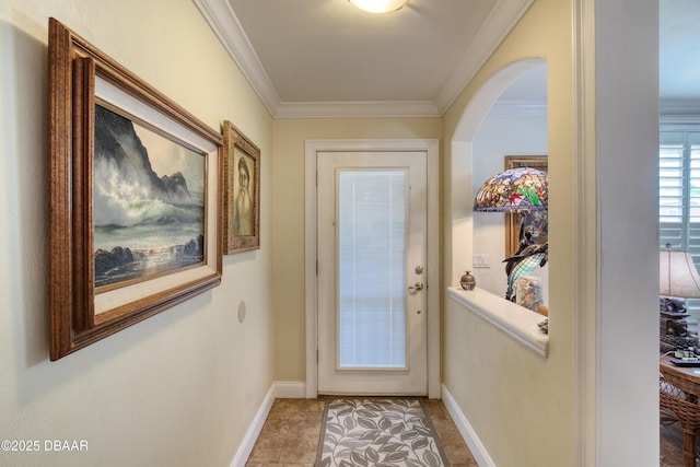 doorway featuring crown molding and tile patterned floors