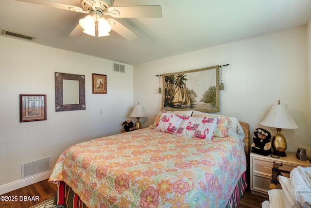 bedroom featuring dark hardwood / wood-style flooring and ceiling fan