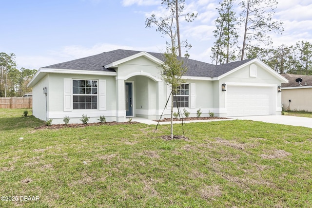 single story home featuring a garage, driveway, a front lawn, and a shingled roof