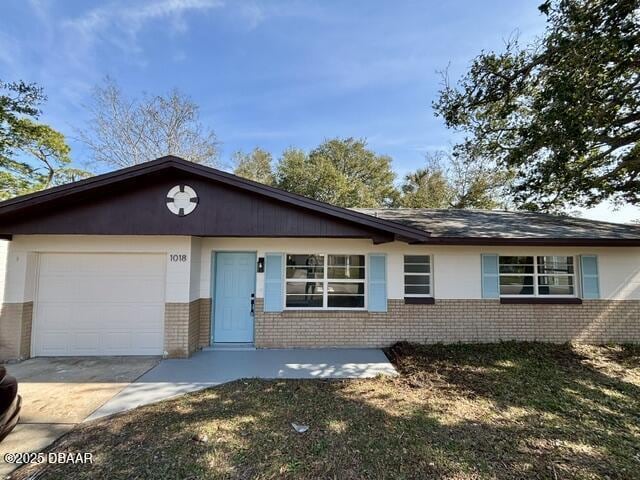 single story home featuring a garage