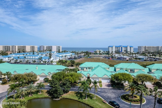 birds eye view of property with a water view