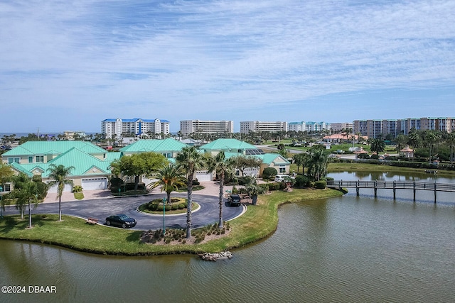 birds eye view of property with a water view