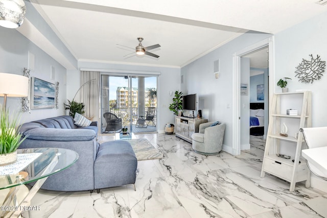 living room with ornamental molding and ceiling fan