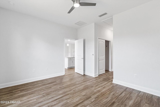 unfurnished bedroom with hardwood / wood-style flooring and ceiling fan