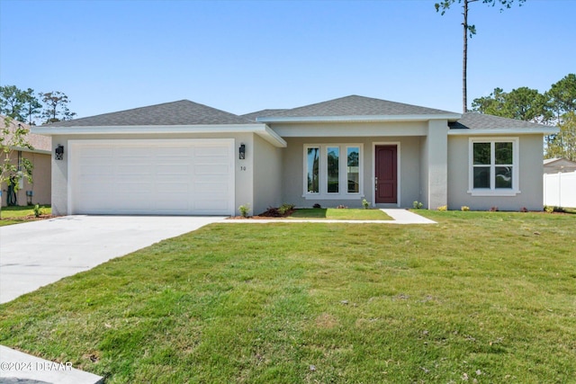 view of front facade featuring a garage and a front yard