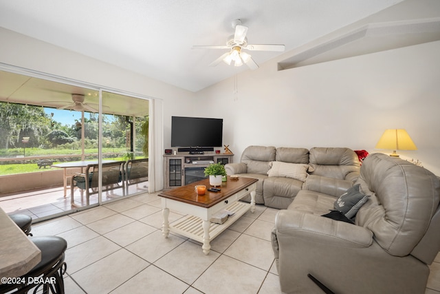 tiled living room with ceiling fan and lofted ceiling