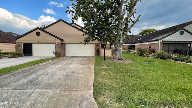 view of front of property with a garage and a front yard