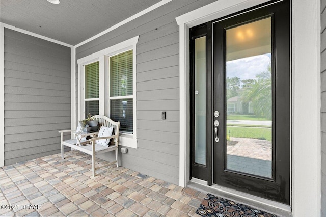 612 Aldenham Ln, Ormond Beach, FL 32174 - view of exterior entry featuring a porch