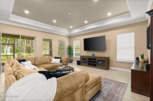612 Aldenham Ln, Ormond Beach, FL 32174 - living area featuring a tray ceiling, crown molding, light tile patterned flooring, recessed lighting, and baseboards
