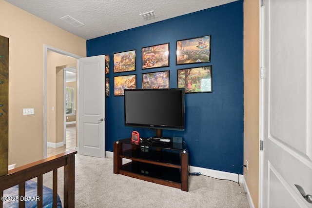 612 Aldenham Ln, Ormond Beach, FL 32174 - bedroom featuring carpet floors, a textured ceiling, and baseboards