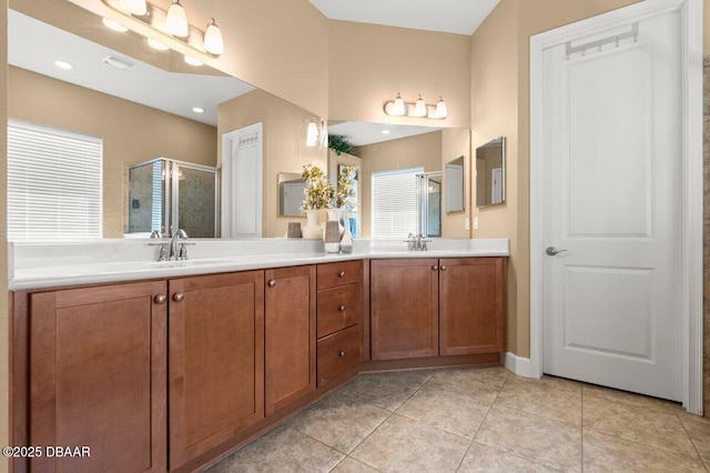 612 Aldenham Ln, Ormond Beach, FL 32174 - full bath with a shower stall, double vanity, tile patterned floors, and healthy amount of natural light