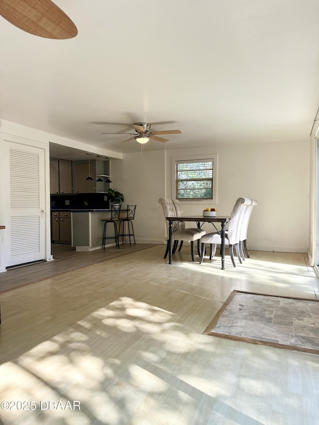 1011 S Peninsula Dr, Daytona Beach, FL 32118 - dining room with a ceiling fan and baseboards