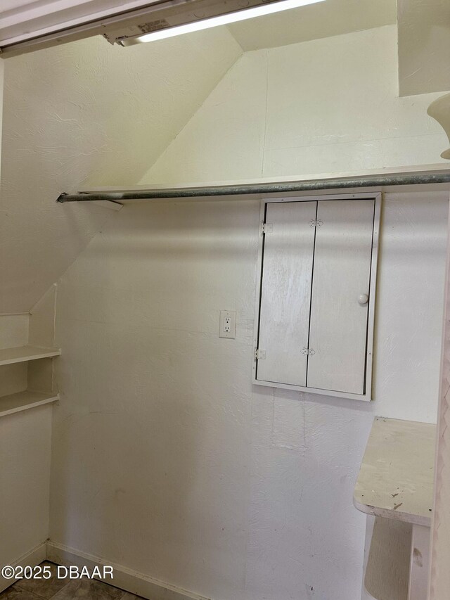 1011 S Peninsula Dr, Daytona Beach, FL 32118 - spacious closet featuring vaulted ceiling