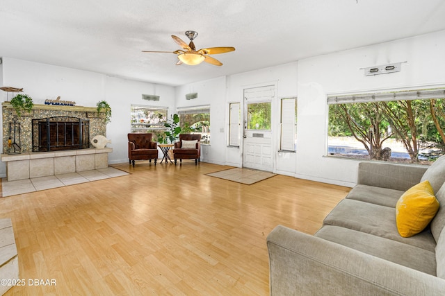 1011 S Peninsula Dr, Daytona Beach, FL 32118 - living room featuring ceiling fan, wood finished floors, and a fireplace