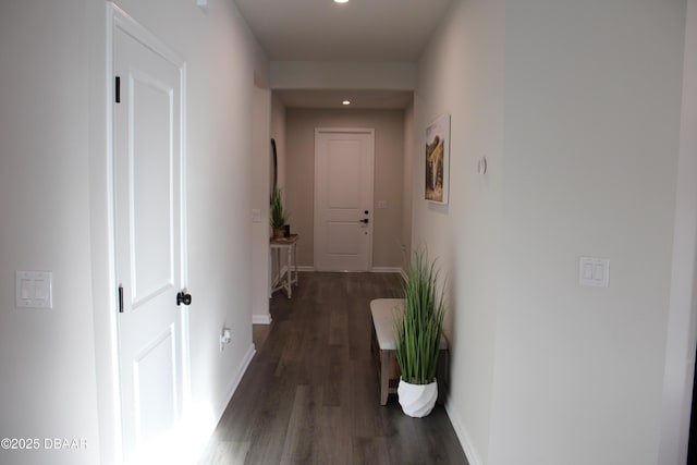 corridor featuring dark hardwood / wood-style floors