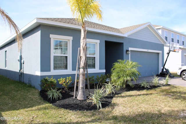 single story home with a garage and a front yard