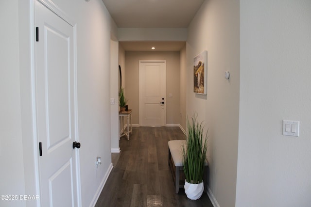 corridor with dark hardwood / wood-style floors