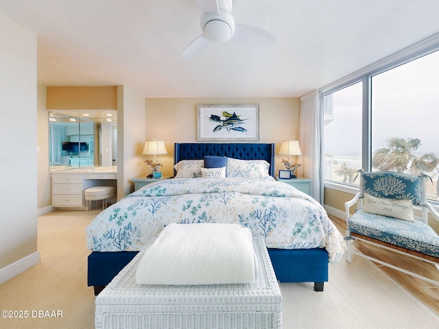 1133 Ocean Shore Blvd Unit 204, Ormond Beach, FL 32176 - bedroom featuring ensuite bathroom, baseboards, and ceiling fan