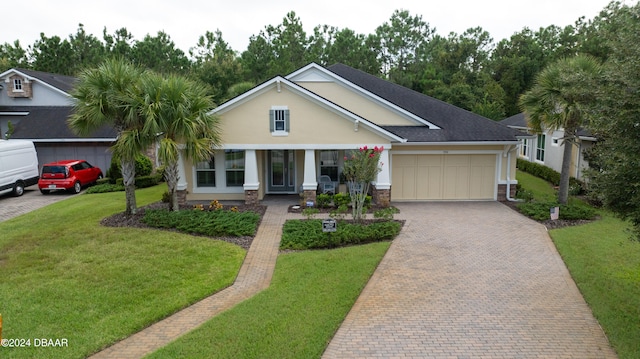 view of front of home with a garage and a front yard