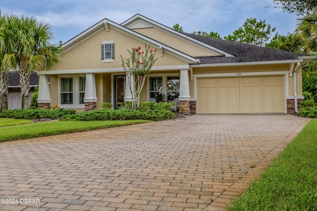 view of front facade featuring a garage and a porch