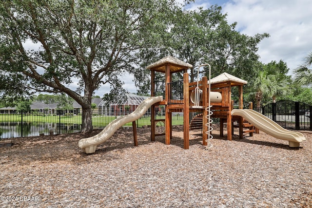 view of playground featuring a water view