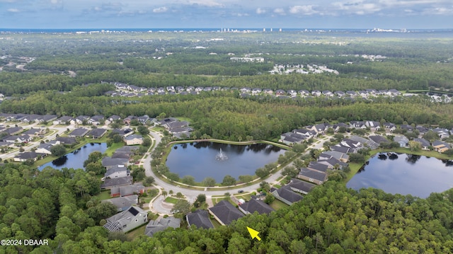 drone / aerial view with a water view