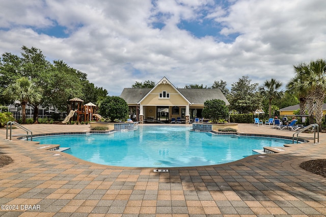 view of swimming pool featuring a patio area