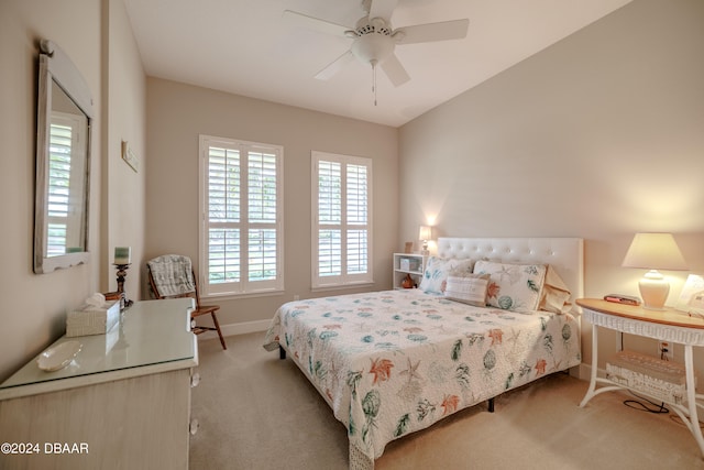 bedroom featuring light carpet and ceiling fan