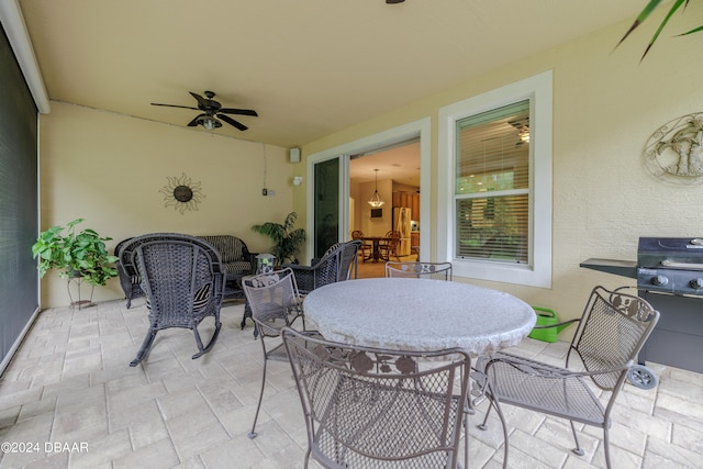 view of patio featuring ceiling fan