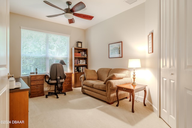 office space featuring light colored carpet and ceiling fan