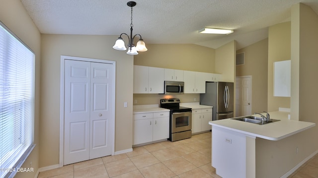 kitchen with appliances with stainless steel finishes, sink, lofted ceiling, and hanging light fixtures