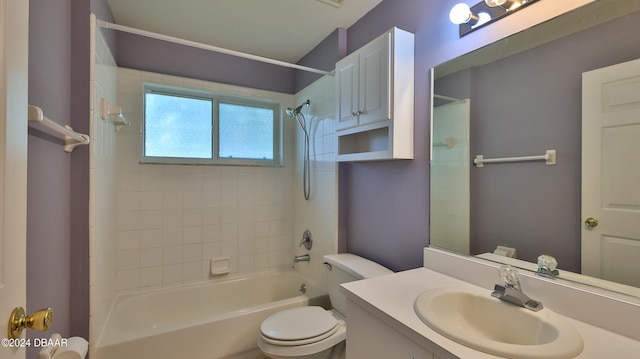 full bathroom with vanity, toilet, and tiled shower / bath