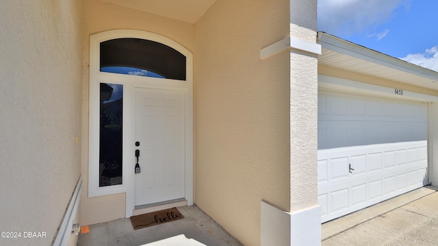 entrance to property featuring a garage