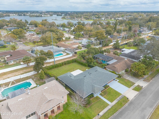 bird's eye view featuring a residential view and a water view