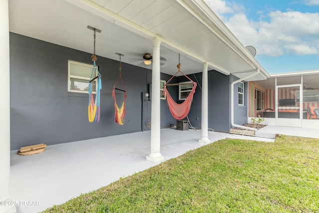 exterior space featuring ceiling fan