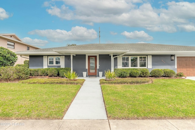 ranch-style home featuring roof with shingles, stucco siding, an attached garage, and a front lawn