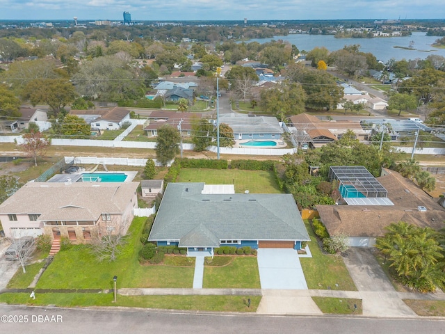 bird's eye view featuring a water view and a residential view