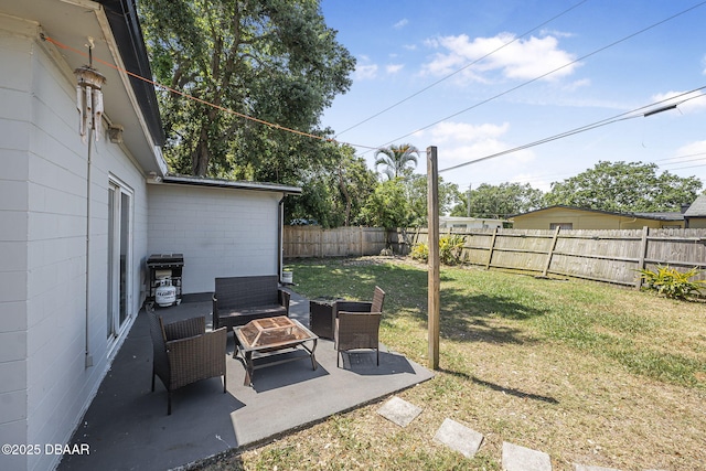 view of yard with a patio area, a fenced backyard, and an outdoor hangout area