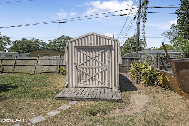 view of shed featuring a fenced backyard