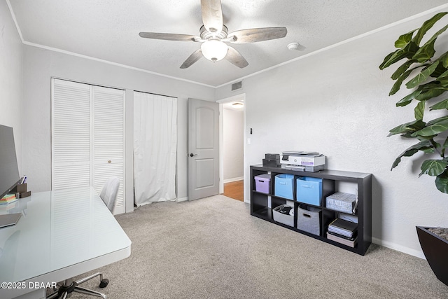 office with ceiling fan, a textured ceiling, and carpet
