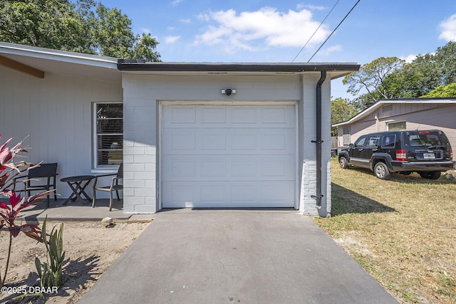 garage with aphalt driveway
