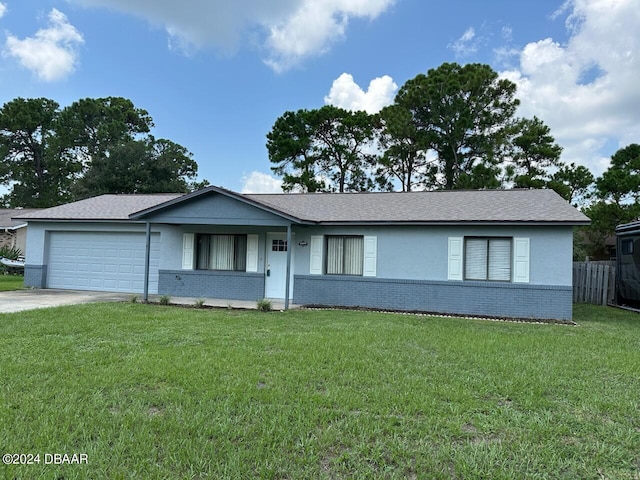 ranch-style home with a garage and a front lawn