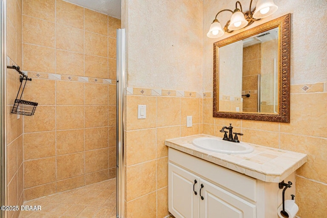 21 Pine Valley Cir, Ormond Beach, FL 32174 - full bath with a shower stall, tile walls, and vanity