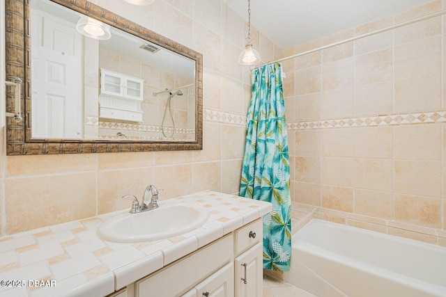 21 Pine Valley Cir, Ormond Beach, FL 32174 - full bath with tile walls, shower / bath combination with curtain, vanity, decorative backsplash, and tile patterned flooring